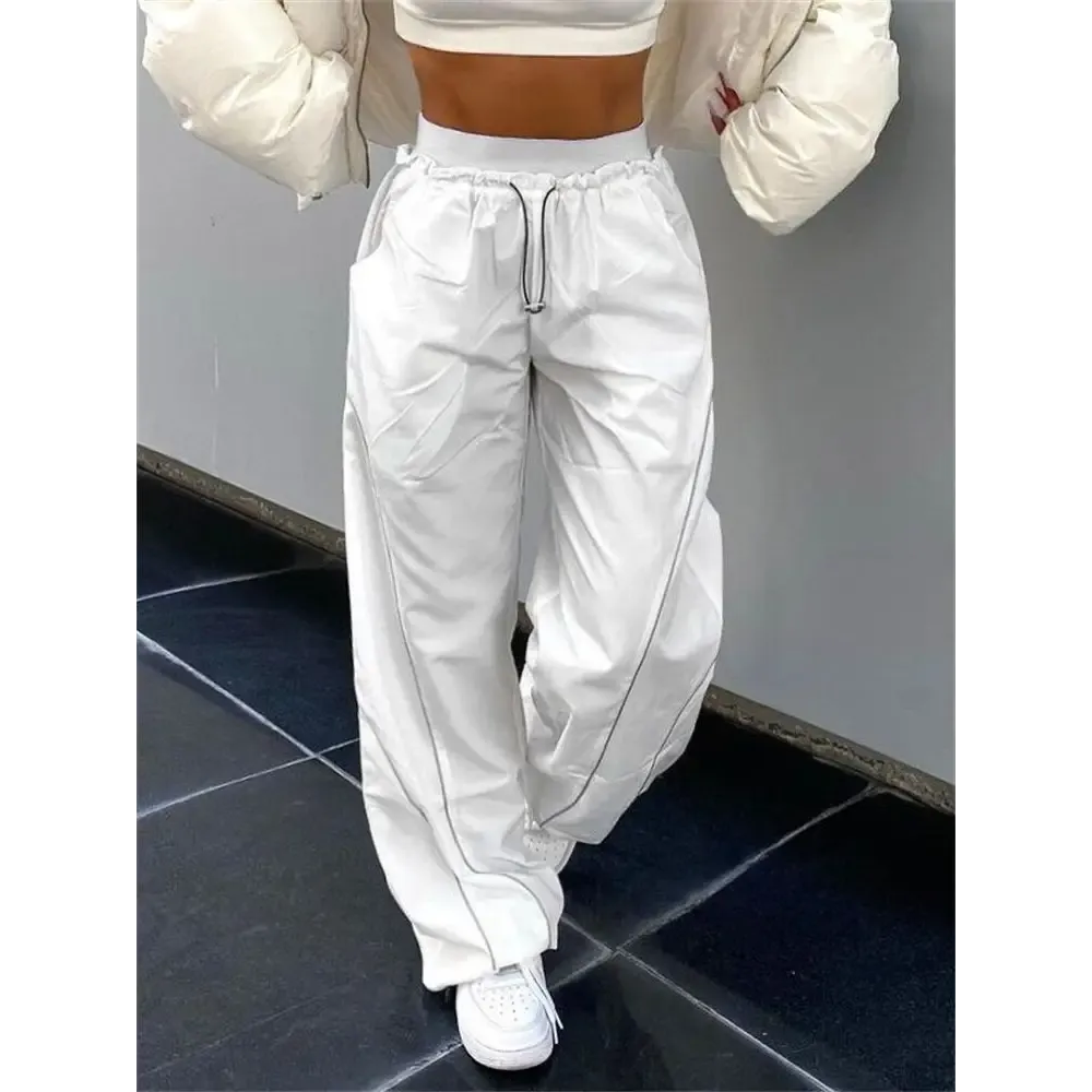 White sports Y2K pants with reflective stripes