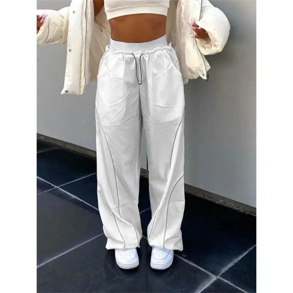 White sports Y2K pants with reflective stripes