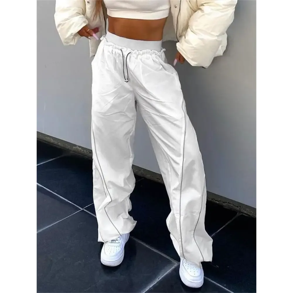 White sports Y2K pants with reflective stripes
